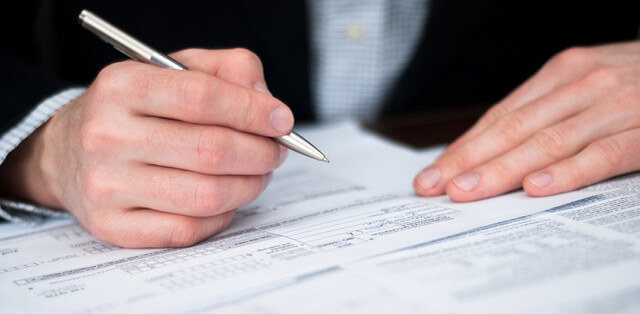 Businessman filling out a form